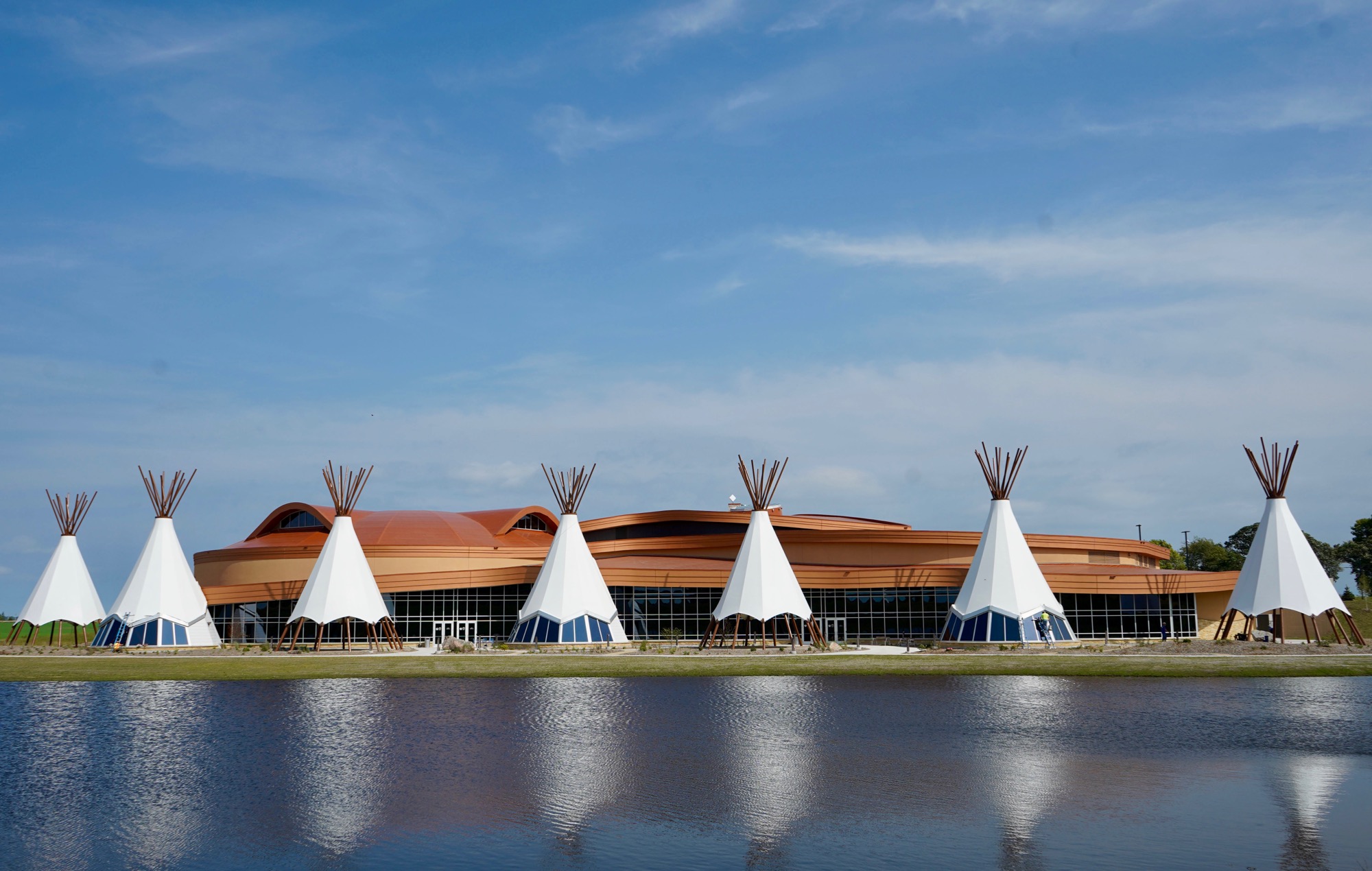 Tribal cultural center designed in a landscape beside the water