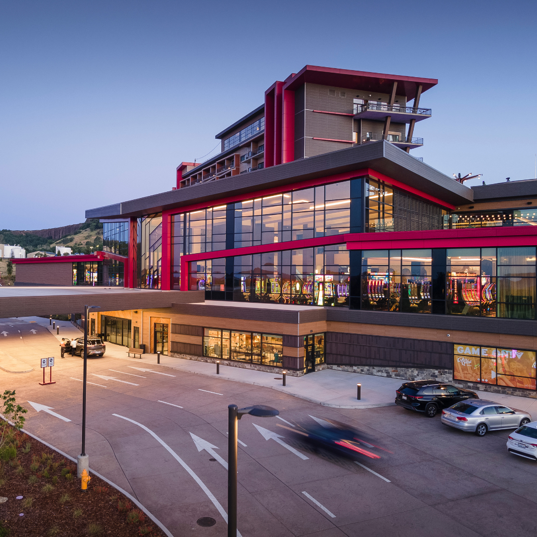Contemporary WORTHGROUP-designed building illuminated in the evening.