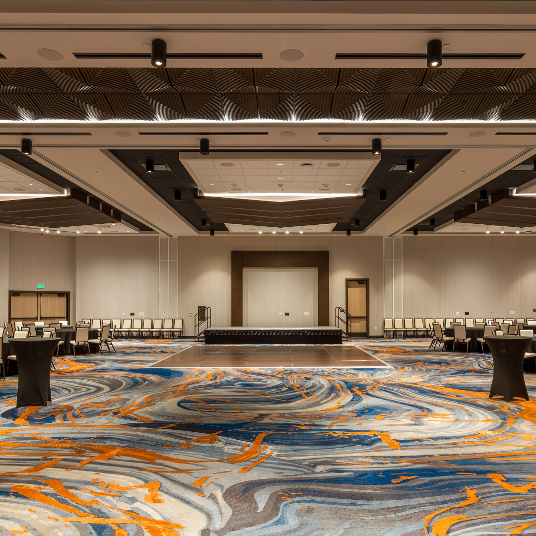 Large event space featuring layered ceiling details.