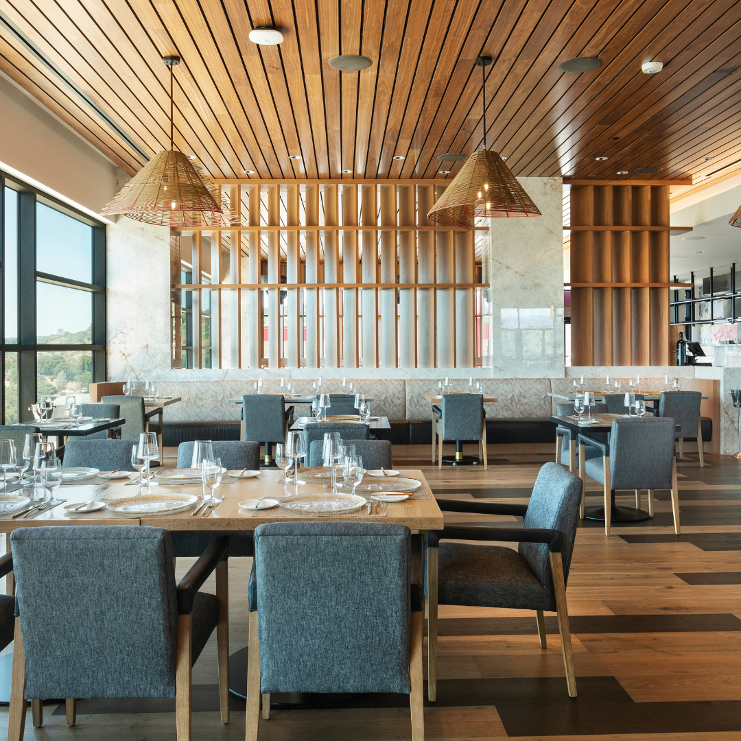 Contemporary dining interior with wood ceiling finishes.